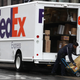 A FedEx worker stacks packages on a cart on December 02, 2019 in San Francisco, California.
